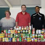 A TOTAL OF 219 canned and non-perishable food items have been collected for the local Bridges program by members of the Grizzly Basketball team as part of its food drive this season, which is being conducted in partnership with the Enactus student organization at Missouri State University-West Plains. With the collected items above are, from left, Enactus Co-Faculty Adviser Cathy Proffitt-Boys, Bridges Coordinator Cyndi Wright, freshman Grizzly guard Dazhonetae Bennett, Grizzly Basketball Head Coach Yancey Walker and Enactus Co-Faculty Adviser Renee Moore. (Missouri State-West Plains Photo).
