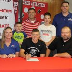THE GRIZZLY LEGACY is alive and well in the Robbins household as West Plains High School Zizzer basketball standout Christian Robbins today followed in his father’s footsteps and signed a national letter of intent to play basketball for the Missouri State University-West Plains Grizzlies. His father, Jason, played for the Grizzlies from 1994-96. On hand for the signing were, seated from left, Melissa, Christian and Jason Robbins; Christian’s brothers, Clayton and Gunner, behind Christian; and, back row, Zizzer Head Coach Kevin Smith and Grizzly Head Coach Chris Popp. (Missouri State-West Plains Photo)