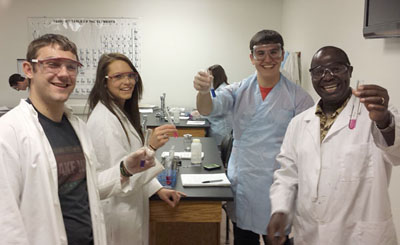 RESEARCH-BASED GUIDED-INQUIRY chemistry experiments are giving students at Missouri State University-West Plains a new, creative approach to traditional lab work and keeping them on the cutting edge of research into new drugs. From left are students Trevor Cressman of West Plains, Brianna Zebert of Pierce City and Adam Kissinger of Pomona, and Associate Professor of Chemistry Dr. Joseph Rugutt. (Photo provided)