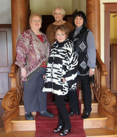 ABOVE ARE, clockwise from bottom, model Sunie Pace wearing a wool cape by Pendleton, which is available at The Kloz Klozet; Friends Publicity Chair Susie Warden; Cleea Walls, owner of Cleea’s At Home Market; and Florence James, owner of The Kloz Klozet. (Missouri State-West Plains Photo)