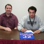 GAGE WOOTEN, right, a sophomore on the Missouri State University-West Plains Grizzly Basketball team, signed a national letter of intent Wednesday, April 11, to attend Minnesota State University in Mankato on a basketball scholarship beginning this fall. With him above is Grizzly Basketball Head Coach Yancey Walker. (Missouri State-West Plains Photo)