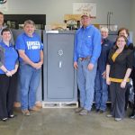 THIS FREEDOM SECURITY Independence Safe 22 gun safe donated by Hirsch Feed and Farm Supply in West Plains will be one of the items up for bid at Missouri State University-West Plains’ 19th Annual Auction Friday, April 5, at the West Plains Opera House. With the safe above are, from left, auction committee member Joe Kammerer, Hirsch parts manager Greg Brown, auction committee member Amanda Niemotka, Hirsch owner John Williams, livestock feed specialist Josh Kenyon and sales representative Sue Wheeler, and auction committee members Debbie Martin, Melissa Hinton, Barbara Nyden and Connie Pfeifer. (Missouri State-West Plains Photo)