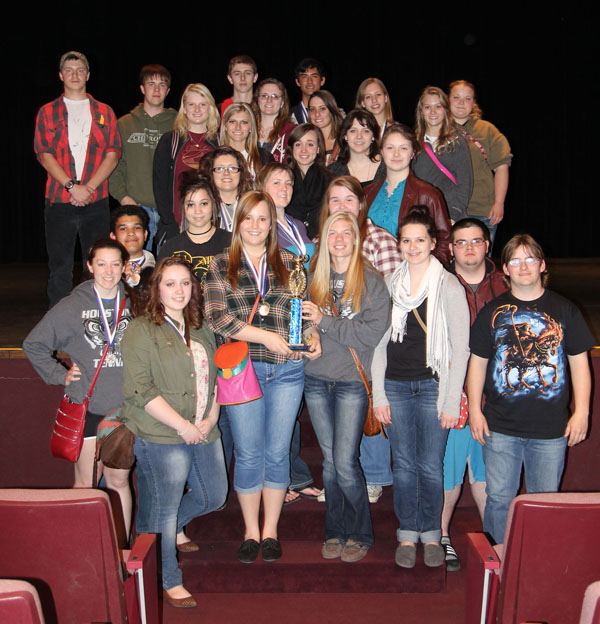 THE TEAM FROM HOUSTON High School took top honors in Division II at the 29th annual Interscholastic Contest hosted by Missouri State University-West Plains on Friday, April 4. With their trophy are, front row from left, Camryn Scheets, Emily Davidson, Madison Dixon, Samantha Garrett, Chandra Hubbs, Barry Schock and Ryan McGrath. Second row: Wesley Monks, Laura Monks, Kristan Bennett, Caroline Dunn and Erika Cooperman. Third row: Kayla Shriver, Veanna Chambers, Candace Cain and Nikki Coleman. Fourth row: Adale Bradshaw, Kayla Frock, Dakota Hugenot, Monica Hunter, Jaycee Huff and Kaitlyn Huff. Back row: Timothy Schmutzler, Cheston Malam, Ryan Bowlin and Ely Todd. (Missouri State-West Plains Photo)