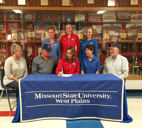 FIRST SIGNING FOR 2017 SEASON – Paula Wiedemann, head coach of the Missouri State University-West Plains Grizzly Volleyball team, picked up her first recruit for the 2017 season this week when Missouri Class 3A All-State honorable mention honoree Koty Cooper of East Newton High School in Granby inked her letter of intent. Cooper racked up numerous honors her senior season, including Big 8 Conference Player of the Year, while helping her Lady Patriots to a 17-15 season record. “We are excited to have Koty as a part of our incoming freshman class. She is athletic and continues to improve in her ability to play the game. Her size and strength make her a presence on the floor, and we look forward to watching her grow with our freshmen. She is a great start to our 2017 recruiting class,” Wiedemann said. On hand for the signing were, seated from left above, stepmother Vonda Cooper, father Steve Cooper, Koty Cooper, mother Sara Camerer and stepfather Pat Camerer; standing: Wiedemann, East Newton High School Volleyball Coach Erin Rice, and Grizzly Volleyball Assistant Coach Briana Walsh. (Photo provided)