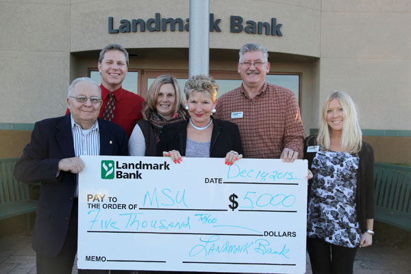 LANDMARK BANK continued its support of higher education in the Ozarks by helping Missouri State University-West Plains raise the minimum $250,000 needed in donations and pledges to endow the university’s third professorship, the Endowed Professorship of Business, which was awarded for the first time during the 2015 fall semester. From left are Missouri State-West Plains Development Board member Royce Fugate and Director of Development Joe Kammerer, and Landmark Bank’s Real Estate Lender Mikela Jones, President Joyce James, Vice President Greg Crews and Commercial Lender Kimberly Bontrager. (Missouri State-West Plains Photo)