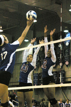 GRIZZIES NELLA IORAMO (No. 13) and Taylor Swayzer (No. 2) go up to block a shot by a John A. Logan College attacker during Friday’s season home-opening match for Missouri State University-West Plains at the West Plains Civic Center. The Grizzlies won the contest 25-9, 25-22, 19-25, 25-10. (Missouri State-West Plains Photo)