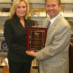 FORMER MISSOURI STATE University Board of Governors member Mary Sheid recently was honored by the Rural Community College Alliance (RCCA) as the Trustee of the Year. Here, she receives the award from Missouri State-West Plains Chancellor Drew Bennett, who accepted the award on her behalf at the RCCA’s annual conference Sept. 25-27 in Dubuque, Iowa.