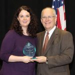 JENNIFER WALKER, who was promoted from financial aid counselor to financial aid coordinator at Missouri State University-West Plains on Jan. 1, received a Staff Excellence in University Service Award during the annual Staff Service Awards program Jan. 11 at Missouri State University in Springfield. The award is given to full-time staff members “who have made significant contributions to the university community. They strive to do their jobs well on a daily basis, go above and beyond the call of duty in a special situation and have contributed in a significant way to the success of the university.” Above, Walker receives a personalized plaque and $1,500 cash award from Missouri State University System President Clif Smart. (Missouri State-West Plains Photo)