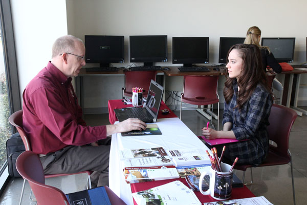 KATIE KAUFMAN, West Plains, visits with Missouri State University Teacher Certification Officer Scott Fiedler about the steps she needs to take to obtain her teaching credentials during Teacher Placement Day Feb. 26 at Gohn Hall on the Missouri State University-West Plains campus. The annual event, hosted by Missouri State’s Teacher Education Completion Program on the West Plains campus and the Missouri State-West Plains Career Development Center, gives students who are in their final semester of an education program, as well as education program graduates, the opportunity to meet with administrators from school districts in south-central Missouri and north-central Arkansas and apply for open teaching positions in those districts. Organizers said 16 administrators representing 10 area school districts interviewed 28 teaching candidates, who represented education programs at Missouri State, Southwest Baptist University, Evangel University, Illinois State University and Haskell Indian Nations University. Organizers said the event was a success, pointing out administrators appreciated the personal interaction they were able to have with the candidates, and the candidates were happy with the exposure to local teaching opportunities and the chance to network with administrators. (Missouri State-West Plains Photo)