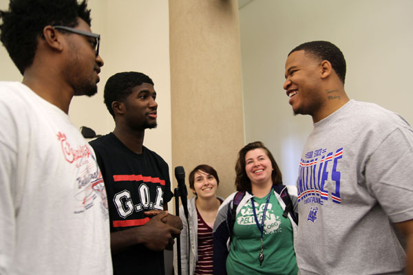 FORMER GRIZZLY BASKETBALL player Tommie Mabry, right, spoke to many students, faculty, staff and community members Oct. 20 at Missouri State University-West Plains about his upbringing in Jackson, Miss., and how he turned his difficult and tumultuous years as a youth into a positive through basketball and education. Mabry played for the Grizzlies during the 2007-08 season and eventually obtained his bachelor’s degree in education at Tougaloo College in his hometown. He is now an admission counselor there. Mabry, a published author, also travels the country as a motivational speaker, encouraging those who attend his presentations to pursue their dreams. Following his two presentations on campus, he visited with students, answering questions and offering copies of his book A Dark Journey to a Light Future. Above, he talks with students, from left, Otha Bell, St. Louis; Malik James, Boston, Mass.; Kayla Noakes, Waynesville; and Alex Pyles, Strafford. (Missouri State-West Plains Photo)