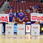 A TOTAL OF 515 new or gently used soft stuffed toys were collected for the U.S Marine Corps Reserve’s annual Toys for Tots campaign during Saturday’s toy toss at the Missouri State University-West Plains Grizzly Basketball game against Iowa Western Community College in the West Plains Civic Center arena. Fans who brought a toy to the game received free admission. Toys were then tossed onto the court after the Grizzlies scored their first points of the contest and given to Toys for Tots for distribution to children in the area who are less fortunate, organizers said. Student organizations were challenged by Missouri State-West Plains Chancellor Drew Bennett to have their members attend the game and bring toys for a $100 prize. The Ag Club won the challenge with 34 members in attendance and 134 stuffed toys collected and donated. With the toys are, from left, Grizzly Basketball Head Coach Chris Popp, U.S. Marine Corps Reserve Jack McNevin, and Grizzly Cheerleaders Peytan Bassett, Michael Mayo, Reece Totty, Skyler Tompkins, Colt Tompkins, Chris Rodgers-Smith and Seth Evans. (Missouri State-West Plains Photo)