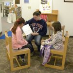 BRITTANY ALLEN, West Plains, a student in Connie Yates’ College Reading and Study Skills (IDS 150) class at Missouri State University-West Plains, reads to a couple of students in Sylvia Hershenson’s third grade class at West Plains Elementary School as part of a service learning project designed to encourage reading and learning among elementary students. The students visited the Garnett Library to become familiar with the library’s services and resources, which are available to the public. Yates pointed out elementary students who are encouraged to read and who are exposed to the college environment are more likely to finish high school, attend college and succeed in a career. The visit took place on Veterans Day Nov. 11. Allen served as a Senior Airman E4 with the U.S. Air Force. (Missouri State-West Plains Photo)