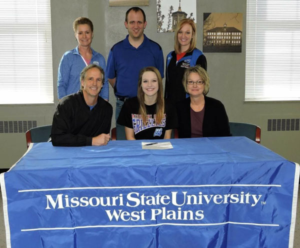 GRACE STUMBAUGH, a 6-foot, 1-inch middle attacker from St. Paul Lutheran High School in Concordia, has signed a letter of intent to play for the Missouri State University-West Plains Grizzly Volleyball team for the upcoming season. Stumbaugh was a honorable mention selection for the Class 2A All-State team during her senior season, and she earned I-70 All-Conference and All-Region honors her junior and senior years. “Grace can be a force at the net, and we are excited she will be on our side,” Grizzly Volleyball Head Coach Paula Wiedemann said. “Her ability to take swiings from anywhere makes us more versatile, and her presence on the floor makes a difference, as well. She has power and will be a lot of fun to watch. She adds to the depth of our incoming freshman class, and we could not be more excited to have Grace become a Grizzly.” On hand for the signing ceremony were, seated from left, Stumbaugh’s father, Rick; Stumbaugh; and her mother, Diana; standing, Wiedemann; St. Paul Lutheran Head Coach Aaron Marsh; and Grizzly Volleyball Assistant Coach Briana Walsh. (Photo provided)