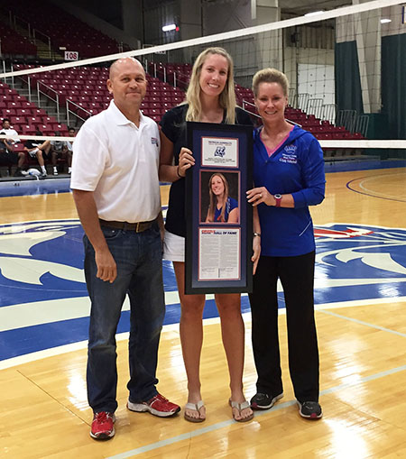 GRIZZLY VOLLEYBALL STANDOUT Patricia Gandolfo, center, was officially inducted to the Grizzly Athletics Hall of Fame during the annual Grizzly Volleyball Alumni Game Saturday, Aug. 19, at the West Plains Civic Center arena. On hand for the plaque presentation were, from left, Grizzly Booster Club Grizzly Booster Club Executive Board Member and chair of the Hall of Fame Selection Committee Russ Gant, left, and Grizzly Volleyball Head Coach Paula Wiedemann. (Missouri State-West Plains Photo)