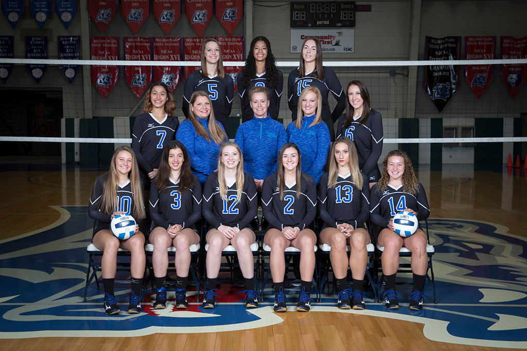 Members of the 2017-18 Grizzly Volleyball team are arranged in rows in the West Plains Civic Center arena. Members includes, front row from left, Kamryn Artale, Springfield; Miriam Cardoner Soler, Barcelona, Spain; Elliotte Bourne, Rolla; Kinli Simmons, El Dorado Springs; Tatjana Trifkovic, Belgrade, Serbia; and Alyssa Matherly, Cabool. Second row: Yileen Ng He, Colon, Panama; Strength and Conditioning Coach Keri Elrod; Head Coach Paula Wiedemann; Assistant Coach Briana Walsh; and Koty Cooper, Stella. Back row: Grace Strumbaugh, Concordia; Keziah Williams, Branson; and Karolina Noszczyk, Bedzin, Poland. (Missouri State-West Plains Photo)