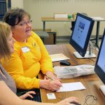 A student receives help filling out the Free Application for Federal Student Aid.