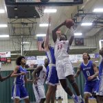 FRESHMAN FORWARD DONTELL BROWN (No. 13) goes up for 2 points during Saturday’s game against Iowa Western at the Holiday Inn Toy Toss Classic. Among those looking on are teammates Niekie Thomas (No. 0) and Radshad Davis (No. 10). (Missouri State-West Plains Photo)