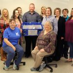 HIT ASSOCIATION MEMBERS already have collected several items for area Head Start students. With those items above are, seated from left, Cynthia Howell, West Plains, and Paula Simandl, Willow Springs. Second row: Jody Nix, West Plains; Josie Hanson, Mountain View; and Melissa Palmer, Sarah Counts and Tosha Gransee, all of West Plains. Back row: Faculty advisor Carla Neff; Stephanie Randall, Jordan Ast (holding box) and Kenna Belcher, all of West Plains; and faculty advisor Tresa Ryan. (Missouri State-West Plains Photo)