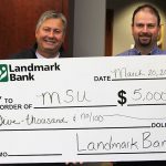 LANDMARK BANK PRESIDENT John Plummer, right, presents a ceremonial check to Missouri State-West Plains Chancellor Drew Bennett for the bank's third installment for the business professorship. (Missouri State-West Plains Photo)