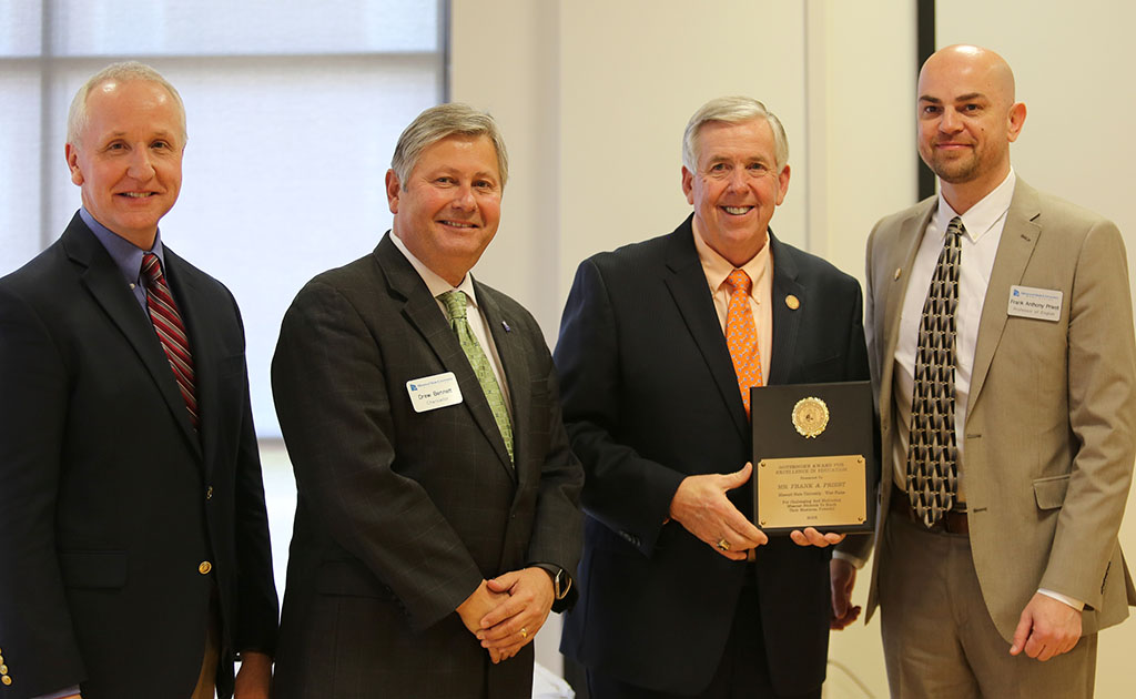 FRANK PRIEST, right, professor of English at Missouri State University-West Plains, received the Governor’s Award for Excellence in Education during an April 5 luncheon in Jefferson City. With him are, from left, Missouri State-West Plains Dean of Academic Affairs Dr. Dennis Lancaster and Chancellor Drew Bennett and Missouri Lieutenant Gov. Mike Parson. (Photo provided)