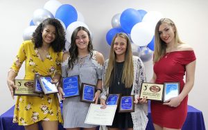 FOUR MEMBERS of the 2017 Grizzly Volleyball team at Missouri State University-West Plains received individual awards during the annual Grizzly Sports Reception Thursday evening, April 12, at the West Plains Civic Center’s Magnolia Room. Kinli Simmons, El Dorado Springs, received awards for NJCAA All-Region 16 Second Team and assists (578 total assists; 6.49 assists per set) and the Marvin Wheeler Academic Excellence Award. Kamryn Artale, Springfield, received awards for NJCAA All Region 16 First Team, Missouri Community College Athletic Conference (MCCAC) All-Conference Second Team, digs (458 total digs; 4.16 digs per set), and service reception (2.30 rating). Keziah Williams, Branson, received awards for NJCAA All-Region 16 First Team, MCCAC All-Conference First Team, kills (254 total kills; 2.23 kills per set; attacking percentage .279) and blocks (total blocks 95, solo blocks 28, assisted blocks 67, blocks per set .86). Tatjana Trifkovic, Belgrade, Serbia, received awards for NJCAA All-Region 16 First Team, MCCAC All-Conference First Team and Newcomer of the Year. From left are Williams, Simmons, Artale and Trifkovic. (Missouri State-West Plains Photo)
