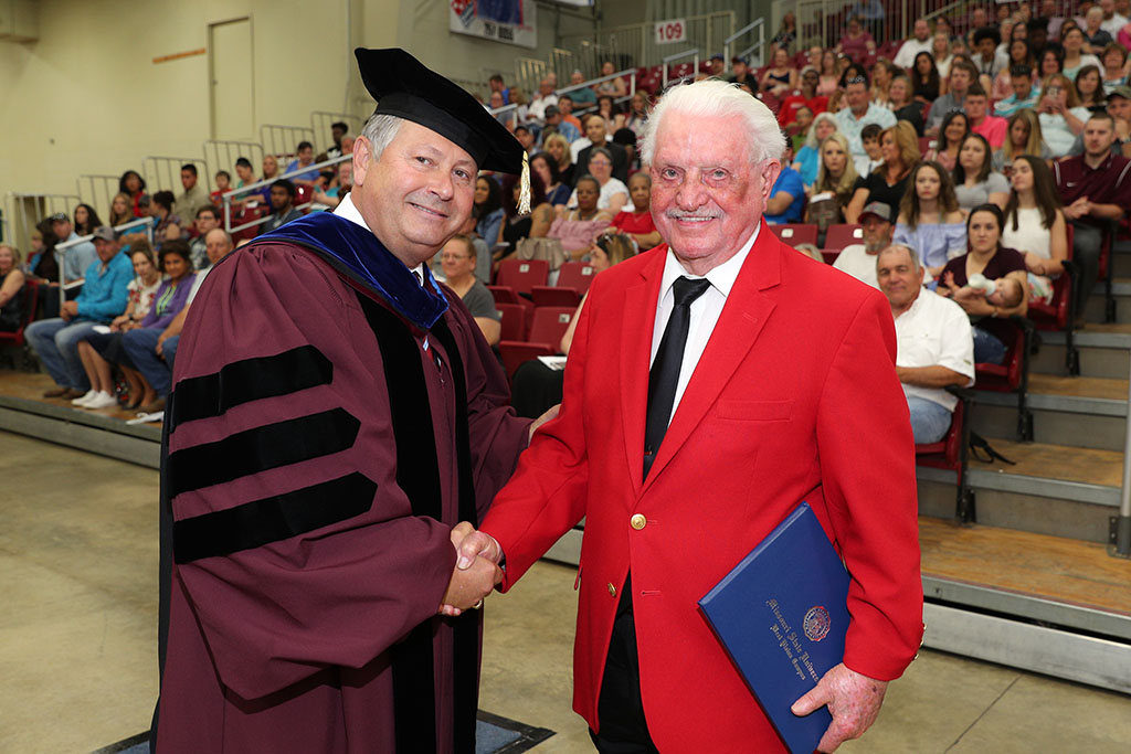 WEST PLAINS RESIDENT JACK MCNEVIN, right, received an honorary Associate of Applied Science degree Saturday, May 19, during Missouri State University-West Plains’ commencement ceremony at the West Plains Civic Center arena. He received his degree from Missouri State-West Plains Chancellor Drew Bennett. (Missouri State-West Plains)