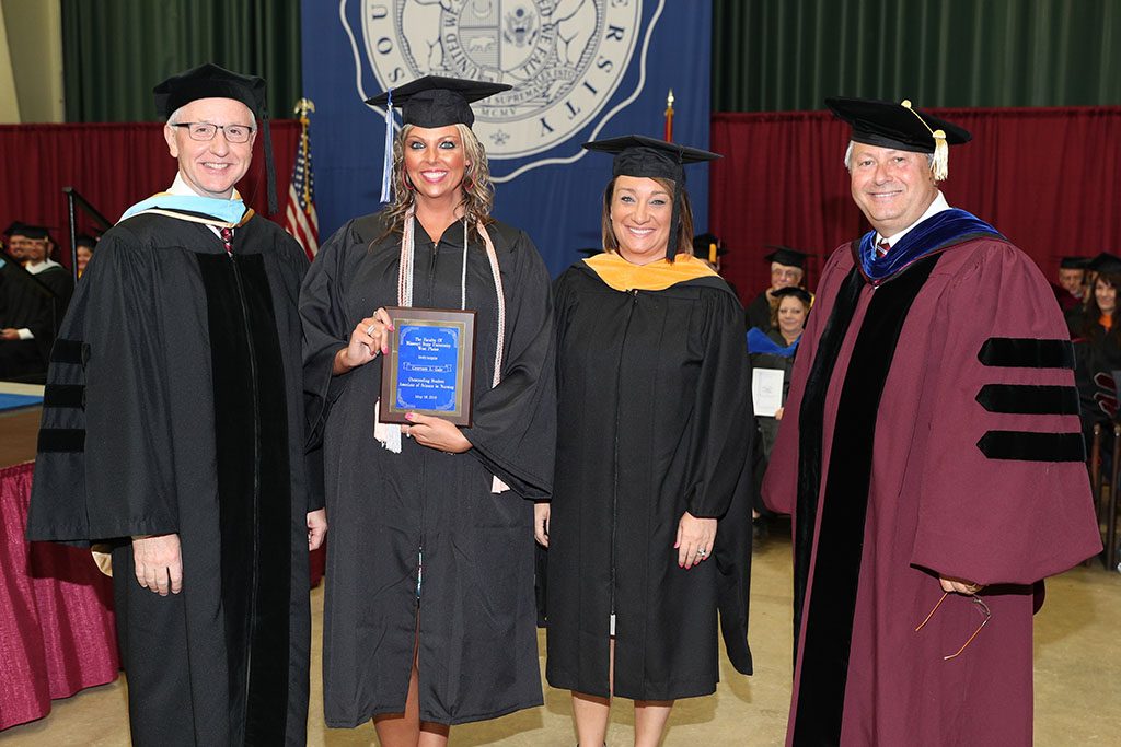 Courtney Gale, West Plains, received the Outstanding Student Award for Associate of Science in Nursing degree graduates at Missouri State University-West Plains’ commencement ceremonies Saturday, May 19, at the West Plains Civic Center. The award recognizes a graduate from ASN program who exhibits academic achievement and honesty, class participation, conscientiousness, university and community service, and outstanding clinical performance. From left above are Missouri State-West Plains Dean of Academic Affairs Dr. Dennis Lancaster, Gale, Assistant Professor/Director of Nursing Amy Ackerson and Chancellor Drew Bennett.  (Missouri State-West Plains Photo)