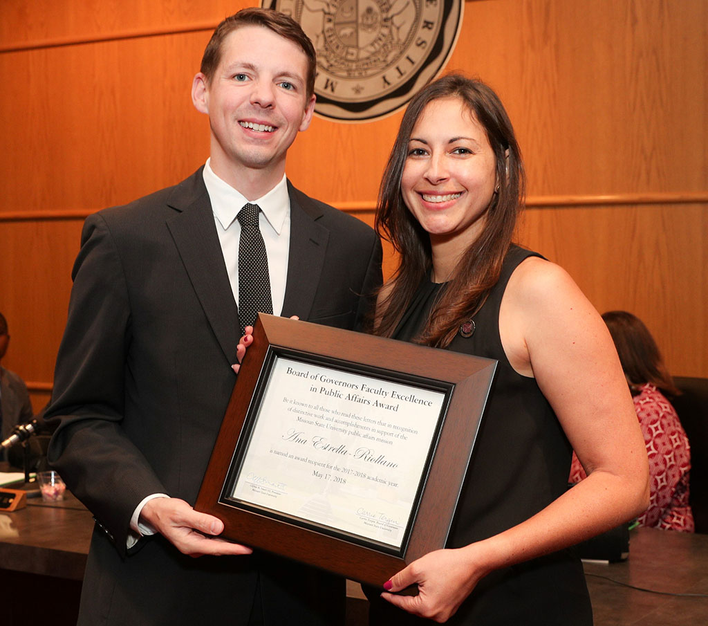 Ana Estrella-Riollano receives her award from Missouri State University Board of Governors member Kendall Seal, Kansas City, who served on the selection committee for the award.  (Missouri State-West Plains Photo)