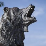 A close-up view of the head of the Grizzly statue on campus
