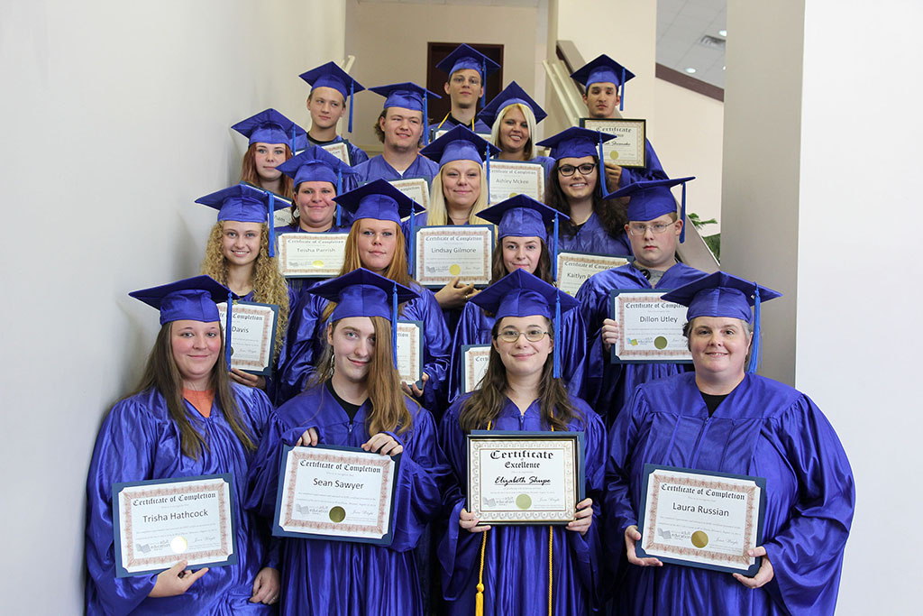 Members of the Adult Education and Literacy Program stand by row with their diplomas. They are, front row from left, Trisha Hathcock, Ava; Sean Sawyer, Cabool; and Elizabeth Shupe and Laura Russian, both of West Plains. Second row: Kaitlyn Davis, Birch Tree; Alice Baldridge and Brooke Bridges, both of Alton; and Dillon Utley, Houston. Third row: Teisha Parrish and Lindsay Gilmore, both of West Plains; and Kaitlyn Bradshaw, Birch Tree. Fourth row: Hannah Grisham, Quinton Busbey and Ashley McKee, all of West Plains. Back row: Joshua Eisenhouer, Houston; and Taylor Barton and Josiah Shoemake, both of West Plains. (Missouri State-West Plains Photo)