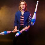 Comedian and juggler Marcus Monroe juggles clubs.