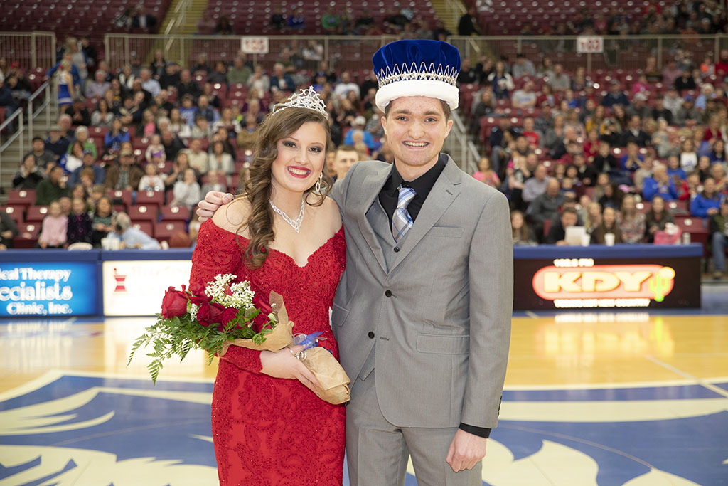 The queen and king stand at center court following their crowning.