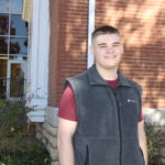 Beam standing in front of Kellett Hall