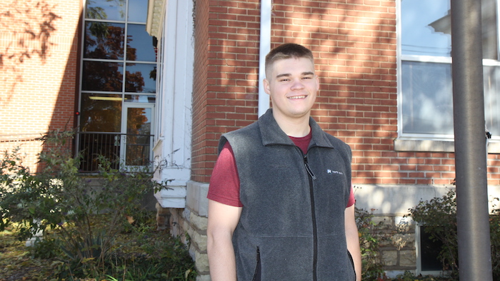 Beam standing in front of Kellett Hall