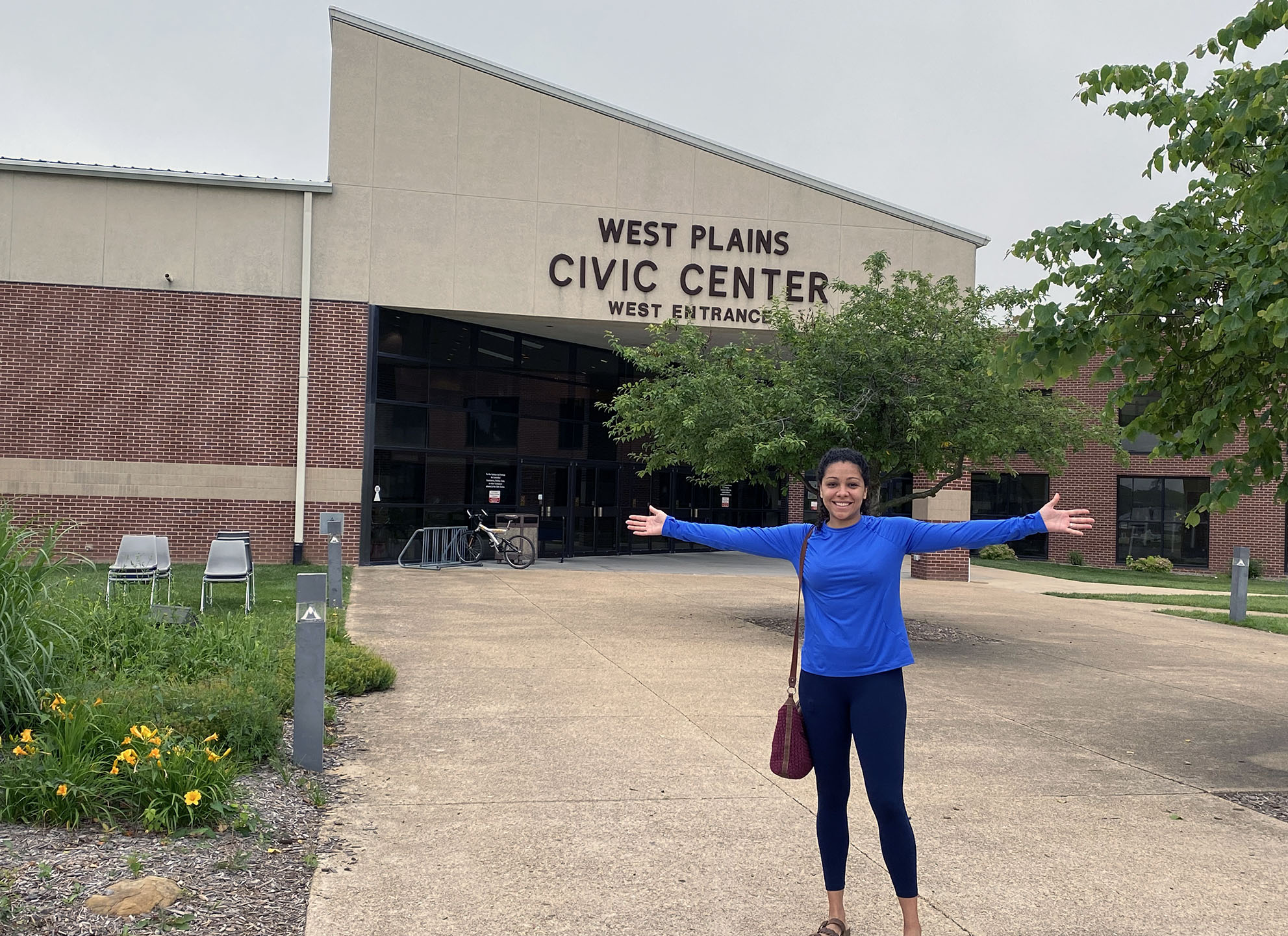 Patricia Figueiredo stands in front of the West Plains Civic Center entrance
