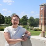 Lydia Davis posed in front of the Smith-London Bell Tower on the West Plains campus